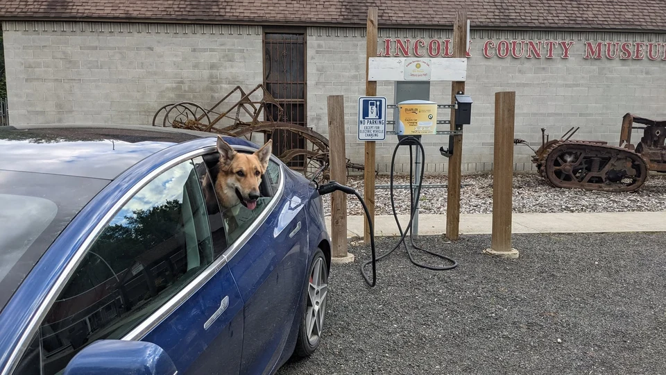 Commercial property manager reviewing EV charging revenue telematics and tenant amenity stations