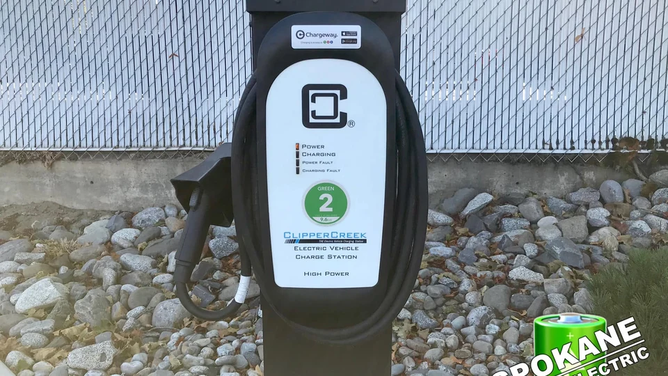Commercial Level 2 and DC fast charging bank installed in Spokane business park parking lot